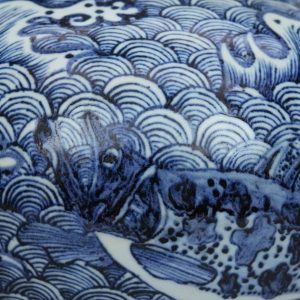 a blue and white ‘fish among waves’ jar