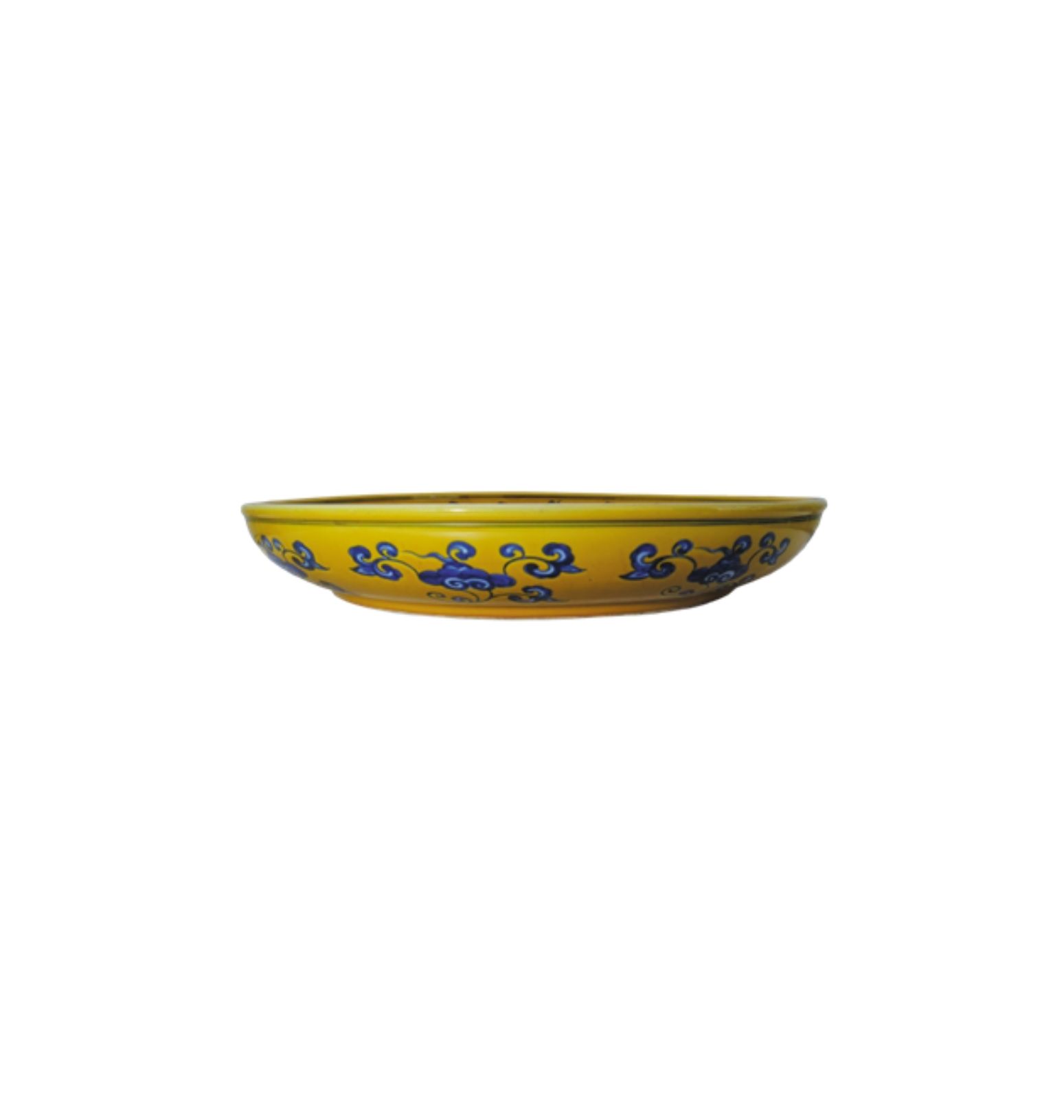 a blue and white dragon dish on yellow ground a blue and white dragon dish on yellow ground